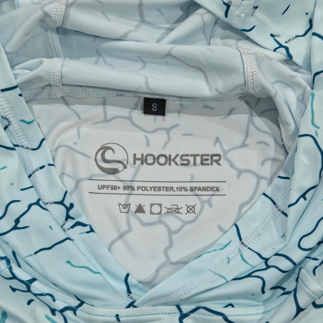 Inside neck label of the Reef Fade UPF 50+ UV hoodie: UPF 50+, 90% polyester, 10% spandex