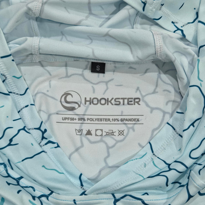 Inside neck label of the Reef Fade UPF 50+ UV hoodie: UPF 50+, 90% polyester, 10% spandex